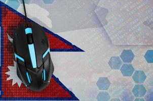 Nepal flag and computer mouse. Digital threat, illegal actions on the Internet photo