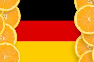 Germany flag in citrus fruit slices vertical frame photo