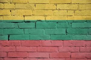 Lithuania flag is painted onto an old brick wall photo