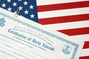 Fs-545 Certification of birth abroad lies on United States flag from US Foreign service photo