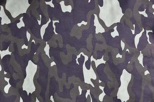 Texture of fabric with a camouflage painted in colors of the marsh. Army background image photo