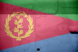 Eritrea flag depicted on side part of military armored helicopter closeup. Army forces aircraft conceptual background photo