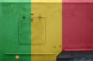 Mali flag depicted on side part of military armored truck closeup. Army forces conceptual background photo