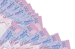 200 Ukrainian hryvnias bills lies isolated on white background with copy space stacked in fan close up photo