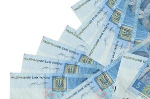 5 Ukrainian hryvnias bills lies in different order isolated on white. Local banking or money making concept photo