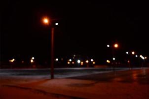 Blurred photo of school playground at night with bright lights