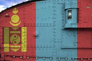 Mongolia flag depicted on side part of military armored tank closeup. Army forces conceptual background photo