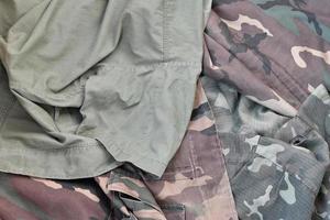 Camouflage background texture as backdrop for army and military design projects photo