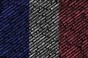 France flag is depicted on the screen with the program code. The concept of modern technology and site development photo