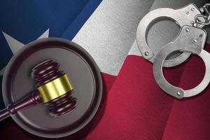 Texas US state flag with judge mallet and handcuffs in dark room. Concept of criminal and punishment photo