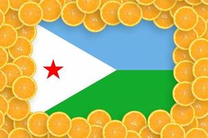 Djibouti flag in fresh citrus fruit slices frame photo