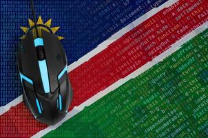 Namibia flag and computer mouse. Digital threat, illegal actions on the Internet photo