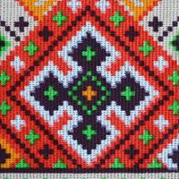 Traditional Ukrainian folk art knitted embroidery pattern on textile fabric photo