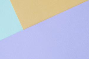 Texture background of fashion pastel colors. Violet, orange, and blue geometric pattern papers. photo