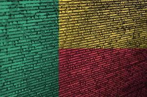 Benin flag is depicted on the screen with the program code. The concept of modern technology and site development photo