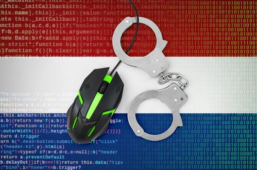Netherlands flag and handcuffed computer mouse. Combating computer crime, hackers and piracy photo