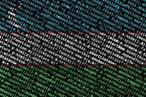 Uzbekistan flag is depicted on the screen with the program code. The concept of modern technology and site development photo