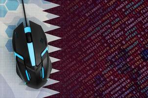 Qatar flag and computer mouse. Digital threat, illegal actions on the Internet photo