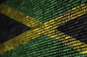 Jamaica flag is depicted on the screen with the program code. The concept of modern technology and site development photo