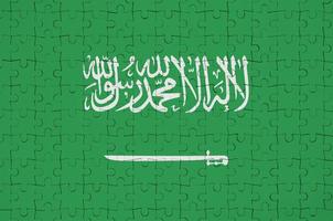 Saudi Arabia flag is depicted on a folded puzzle photo