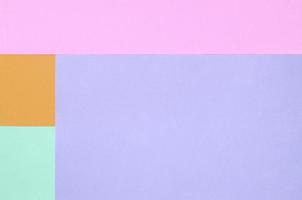 Texture background of fashion pastel colors. Pink, violet, orange and blue geometric pattern papers. photo