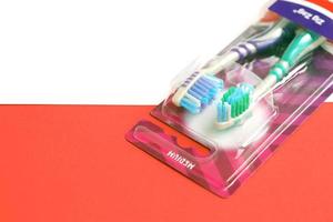 TERNOPIL, UKRAINE - JUNE 23, 2022 Colgate toothbrushes, a brand of oral hygiene products manufactured by American consumer-goods company Colgate-Palmolive photo