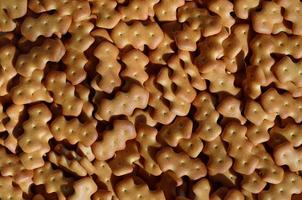 Pattern of a many yellow salted crackers photo