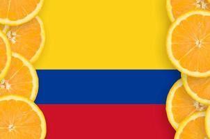 Colombia flag in citrus fruit slices vertical frame photo