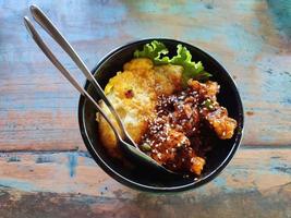 rice chicken katsu with wood background premium photo
