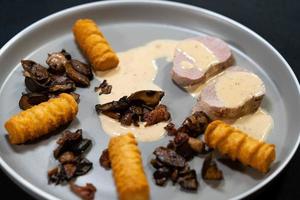 fillet steak tenderloin cut with herbs spices and mushrooms photo