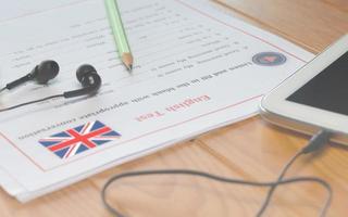 English listening test on wooden desk photo
