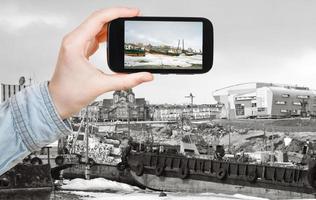 tourist taking photo of Anadyr harbor in winter