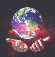 Earth and environment in hand on black background. Love the earth concept, protect the environment, earth day photo