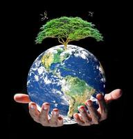 Earth and environment in hand on black background. Love the earth concept, protect the environment, earth day photo