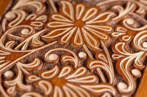 A close-up of vintage oriental artistic wood carving. Central Asia, Uzbekistan photo