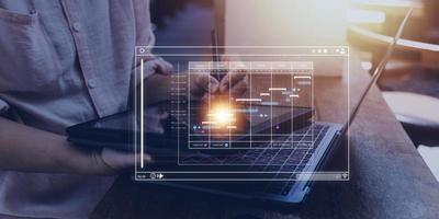 Analyst working with computer in Business Analytics and Data Management System to make report with KPI and metrics connected to database. Corporate strategy for finance, operations, sales, marketing photo