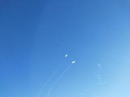 Explosions of rockets and air defense in the sky photo