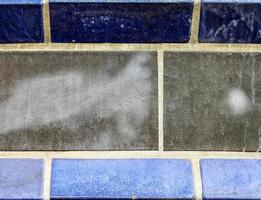 Detailed close up texture on structured floor tiles on the ground photo