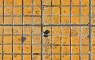 Detailed close up texture on structured floor tiles on the ground photo