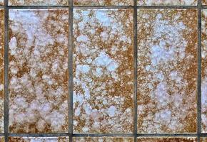 Detailed close up texture on structured floor tiles on the ground photo