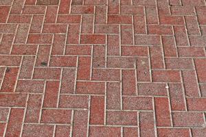 Detailed close up texture on structured floor tiles on the ground photo