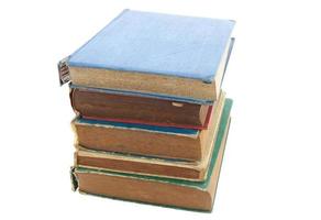 Pile of old books isolated on white background photo