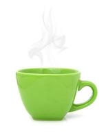 Green cup with hot drink on white background photo
