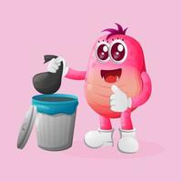 Cute pink monster placing reusable waste into garbage can vector