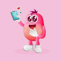 lindo monstruo rosa sosteniendo un teléfono móvil con mensajes de texto vector