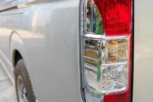 The red and white brake lights and reversing lights of the transport van were broken due to a collision.accident and insurance concept photo