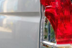 The red and white brake lights and reversing lights of the transport van were broken due to a collision.accident and insurance concept photo