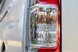 The red and white brake lights and reversing lights of the transport van were broken due to a collision.accident and insurance concept photo