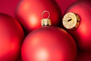 Close-up of red Christmas baubles. Place for text. photo