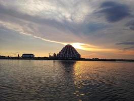 Makassar, Indonesia, June 31, 2022-a mosque in the middle of the sea looks beautiful surrounded by sunsets located on Losari beach photo